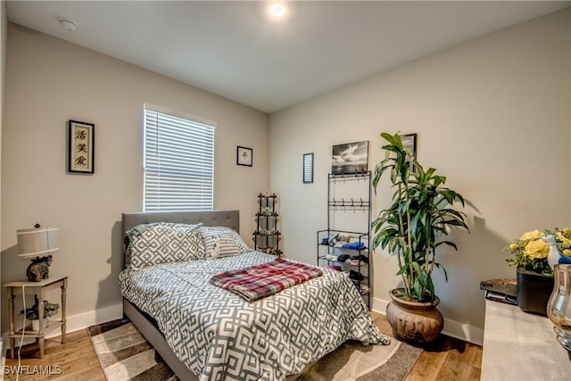 bedroom with light hardwood / wood-style floors