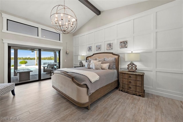 bedroom with hardwood / wood-style flooring, a notable chandelier, beam ceiling, and access to outside