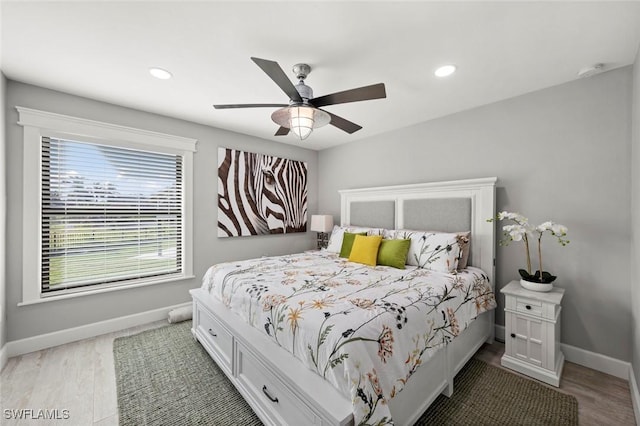 bedroom featuring wood-type flooring and ceiling fan