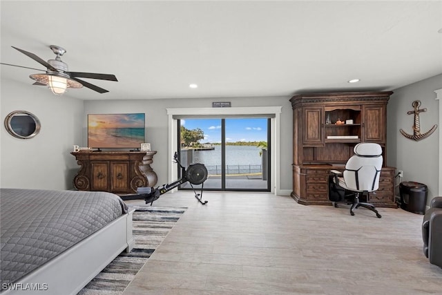 bedroom featuring ceiling fan, light hardwood / wood-style floors, and access to outside