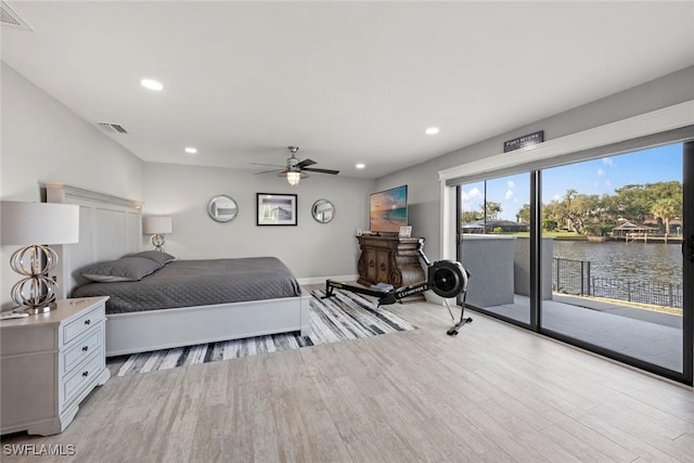 bedroom with access to exterior, light hardwood / wood-style flooring, and ceiling fan