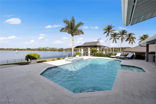 view of swimming pool with an in ground hot tub, a gazebo, a water view, and a patio area