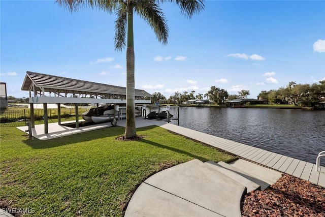 dock area featuring a lawn and a water view