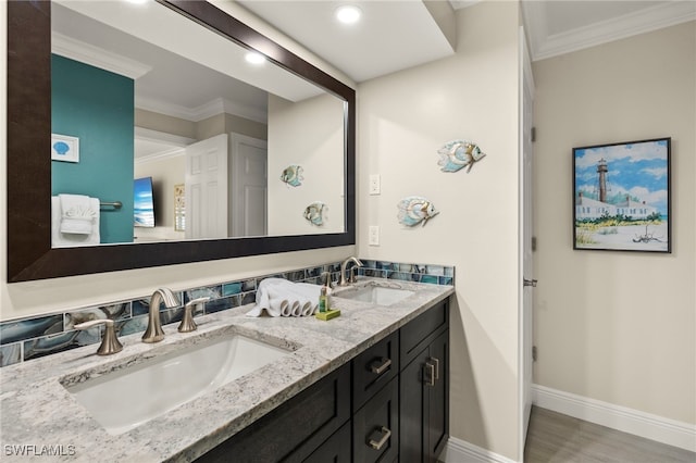 bathroom with vanity and ornamental molding