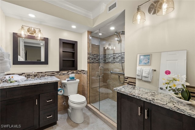 bathroom featuring tile patterned floors, an enclosed shower, ornamental molding, vanity, and toilet