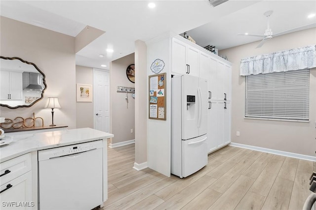 kitchen featuring light wood-type flooring, white appliances, white cabinetry, and ceiling fan