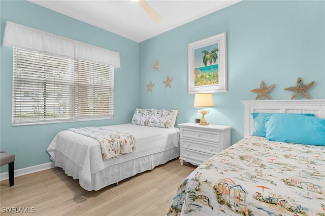 bedroom featuring ceiling fan and light wood-type flooring