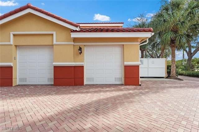 view of front of property with a garage