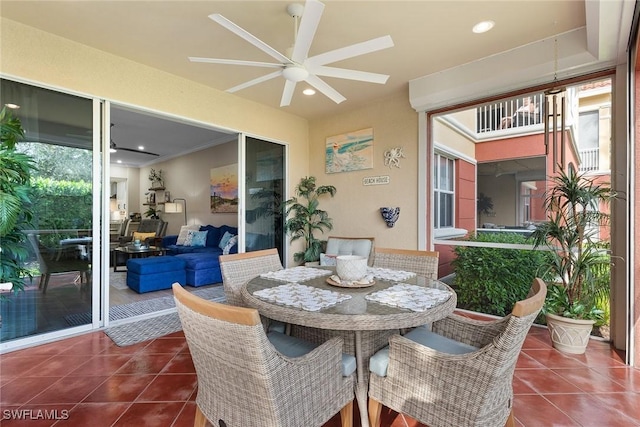 sunroom featuring ceiling fan