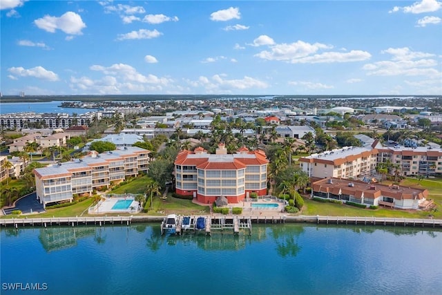 birds eye view of property with a water view