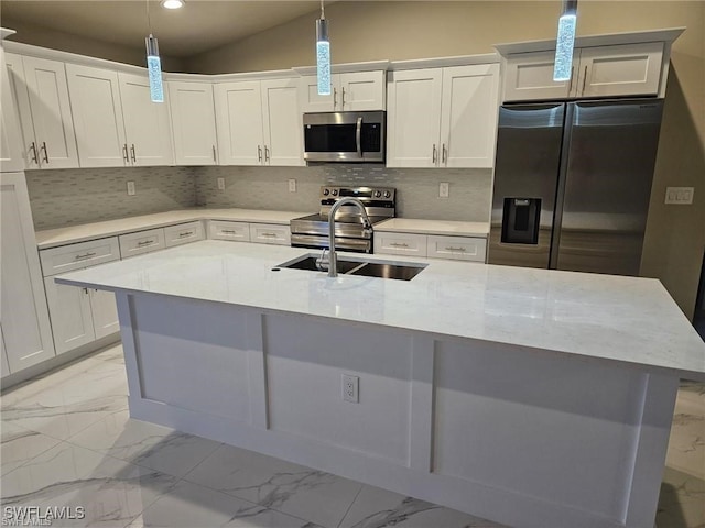 kitchen with sink, white cabinets, pendant lighting, and stainless steel appliances