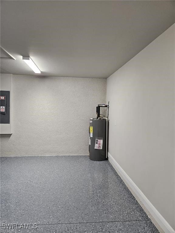 utility room featuring electric panel and water heater