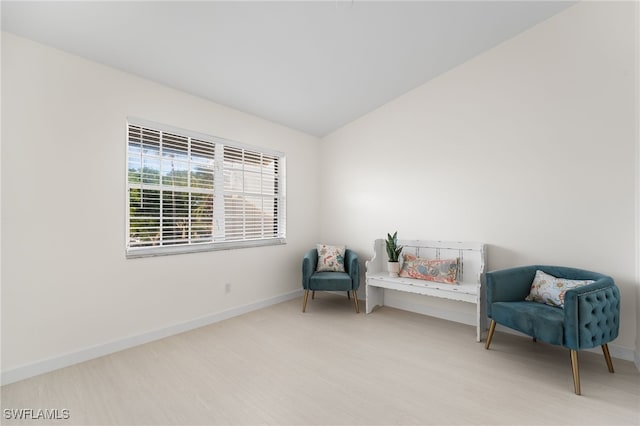 living area with vaulted ceiling