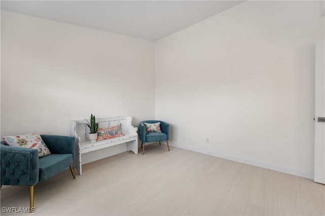 sitting room featuring light hardwood / wood-style floors