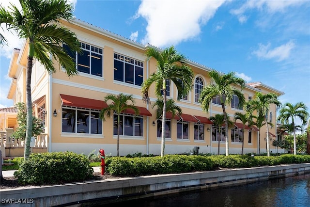 view of building exterior with a water view