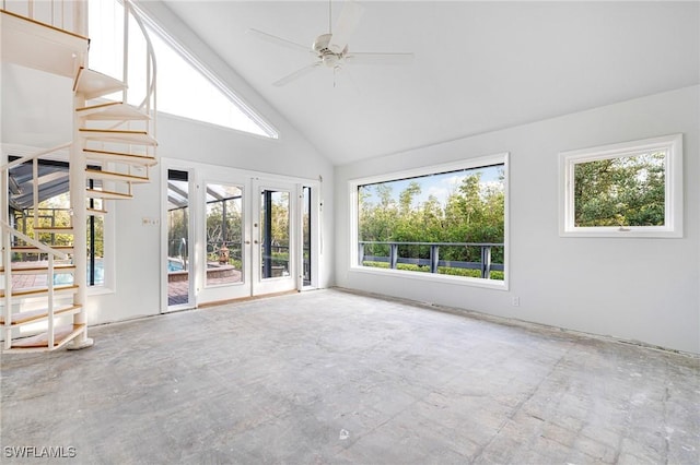 interior space featuring ceiling fan, lofted ceiling, and french doors