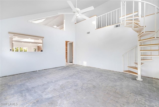 unfurnished living room with vaulted ceiling and ceiling fan