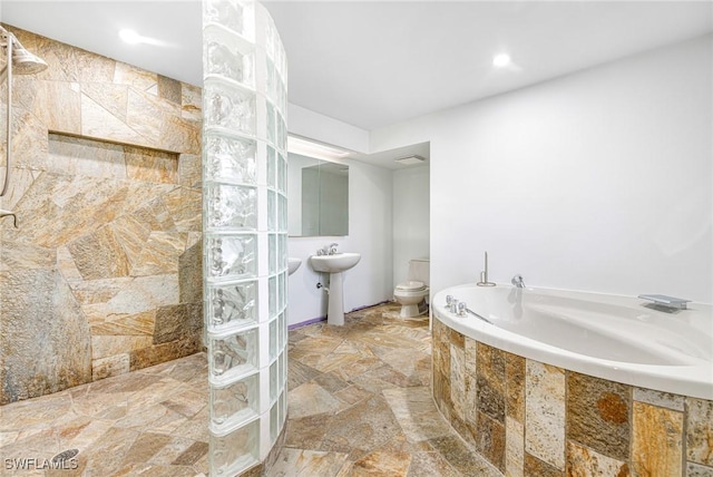 bathroom with shower with separate bathtub and toilet