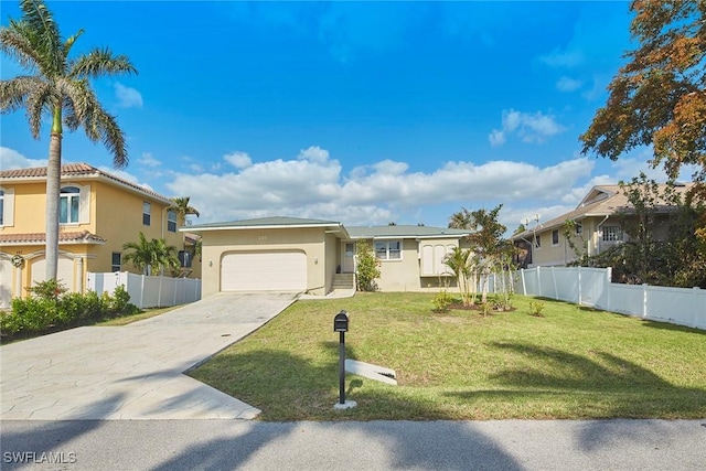 view of front facade with a garage and a front yard