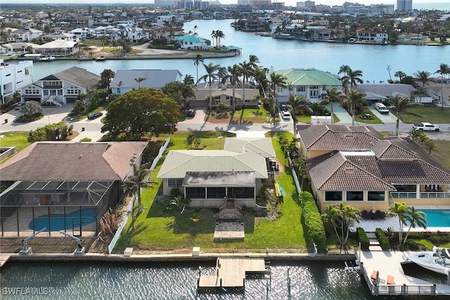 birds eye view of property featuring a water view