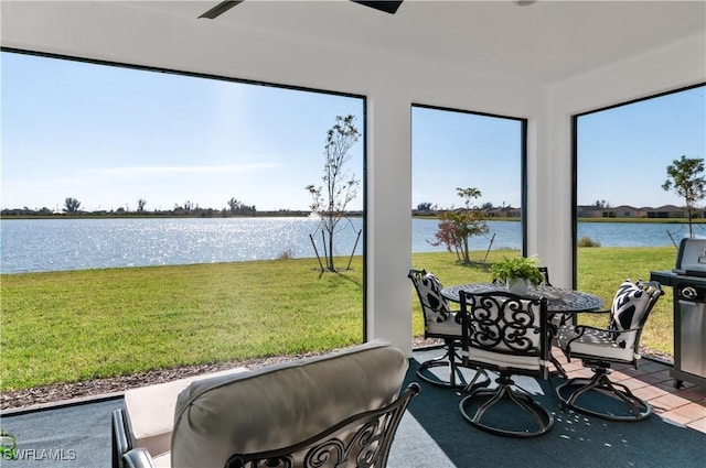 sunroom with a water view