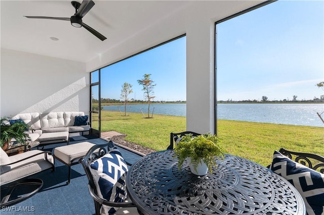 view of patio with an outdoor living space, a water view, and ceiling fan