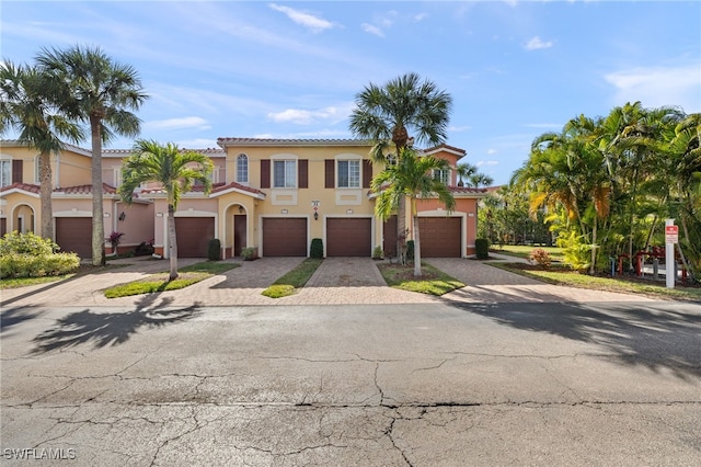 mediterranean / spanish-style house featuring a garage