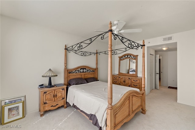 bedroom featuring light carpet and ceiling fan