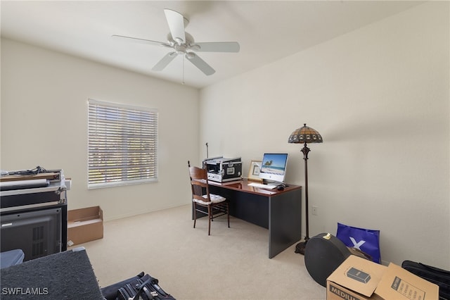 office space with ceiling fan and light carpet