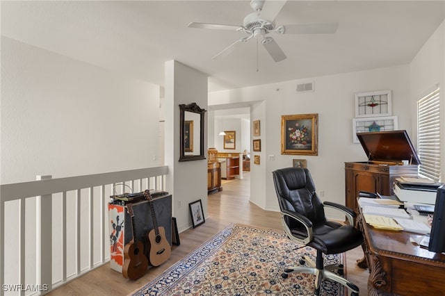 office featuring ceiling fan and light hardwood / wood-style flooring