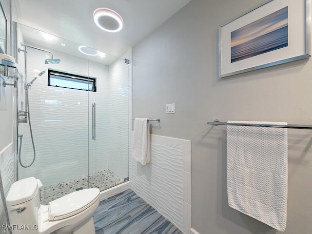 bathroom with toilet and walk in shower