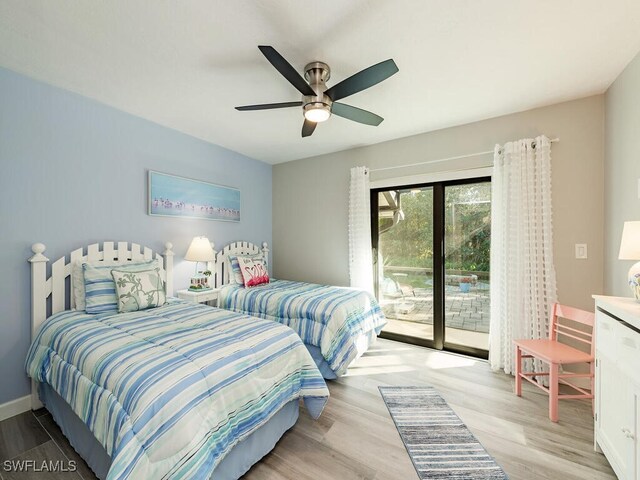 bedroom with access to outside, light hardwood / wood-style flooring, and ceiling fan