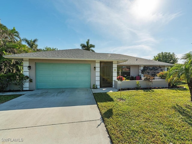 single story home featuring a front yard and a garage