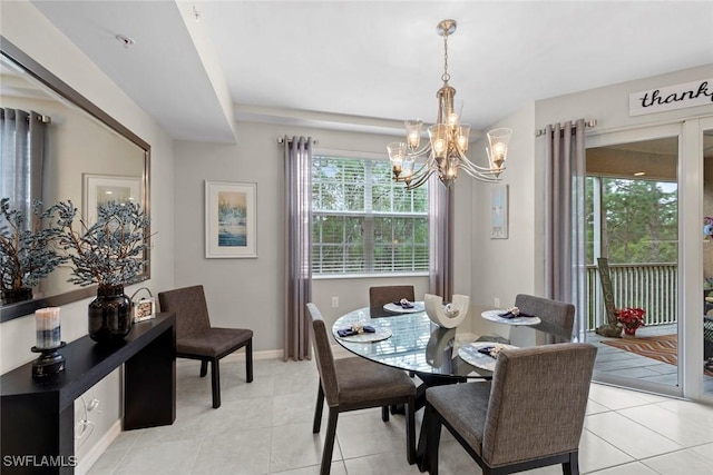 tiled dining area featuring an inviting chandelier