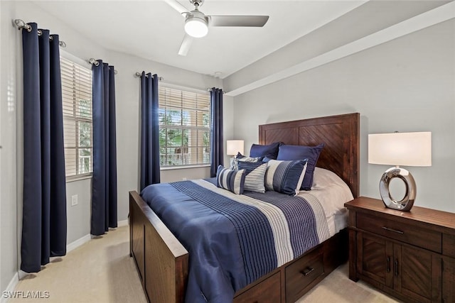 bedroom featuring light carpet and ceiling fan