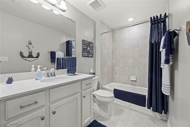 full bathroom with tile patterned flooring, shower / bath combo, vanity, and toilet