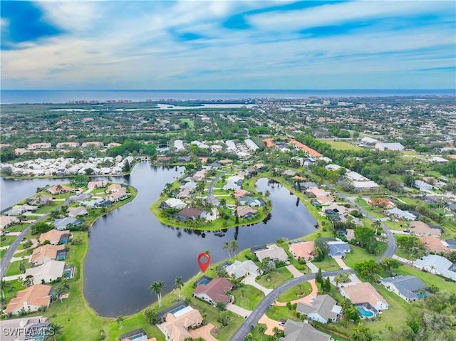 bird's eye view with a water view