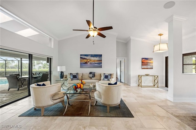 living room featuring ceiling fan, plenty of natural light, high vaulted ceiling, and ornamental molding