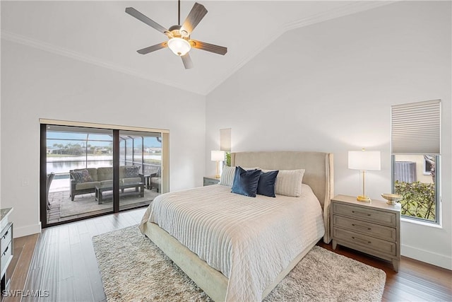 bedroom with access to exterior, ceiling fan, dark hardwood / wood-style flooring, and multiple windows