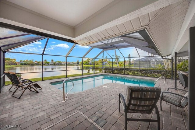 view of swimming pool with a lanai, a patio area, and a water view