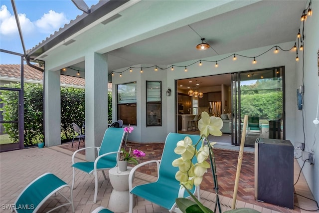 view of patio with a lanai