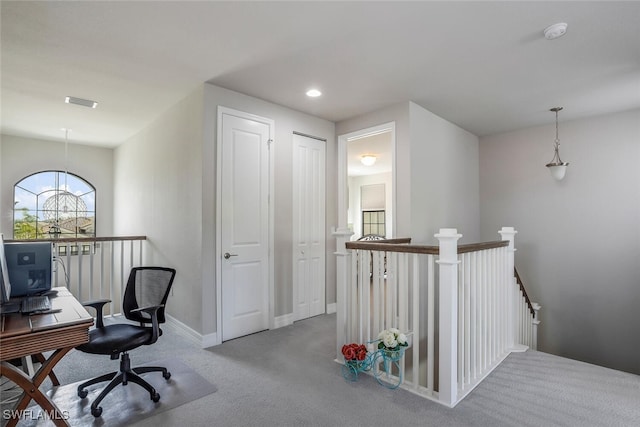 office area featuring light colored carpet