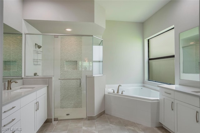 bathroom with plus walk in shower, vanity, and tile patterned floors