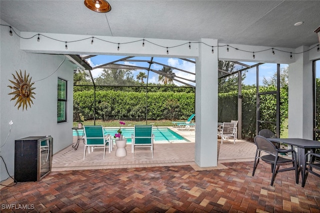 view of patio / terrace with a lanai