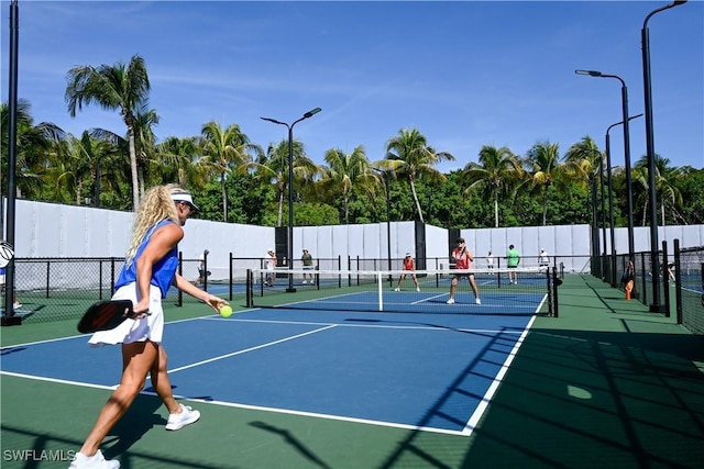 view of sport court with fence