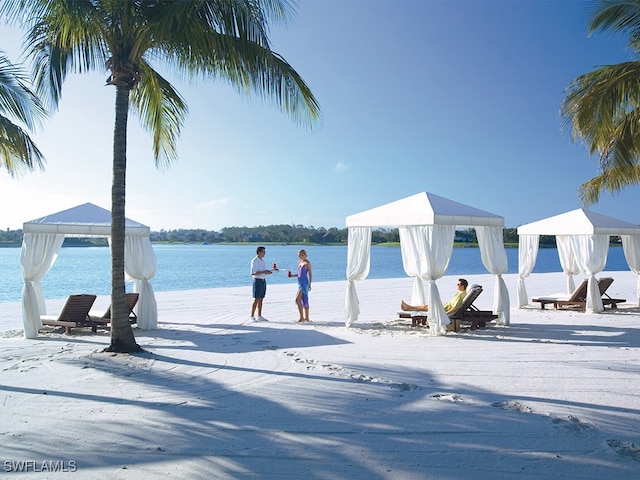 view of property's community featuring a water view and a gazebo