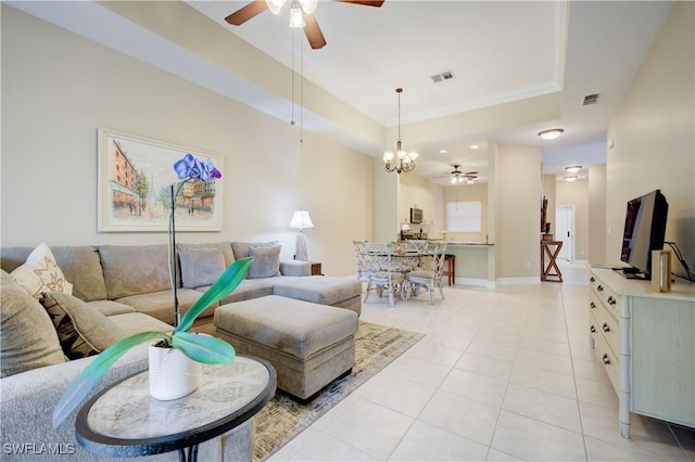 living room with ceiling fan with notable chandelier, crown molding, and light tile patterned flooring