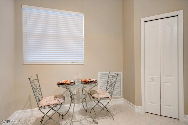 sitting room with light tile patterned flooring