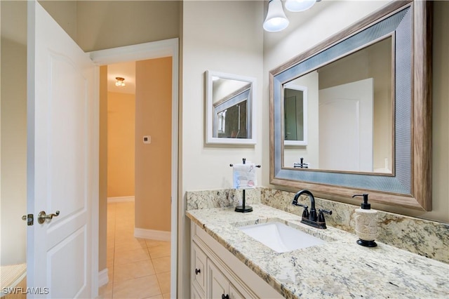 bathroom with tile patterned floors and vanity