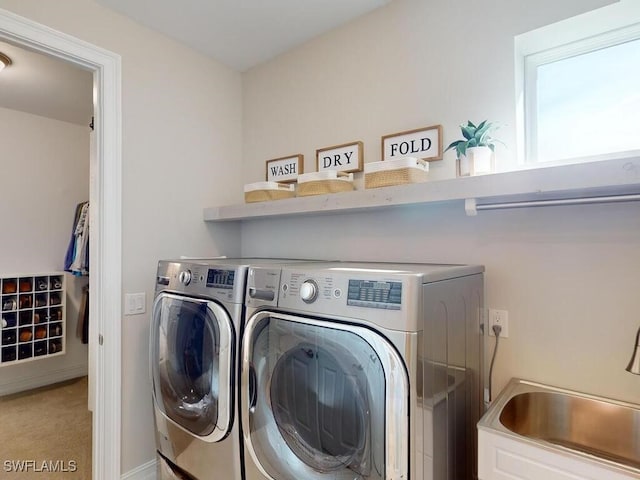 laundry room featuring washer and dryer and sink